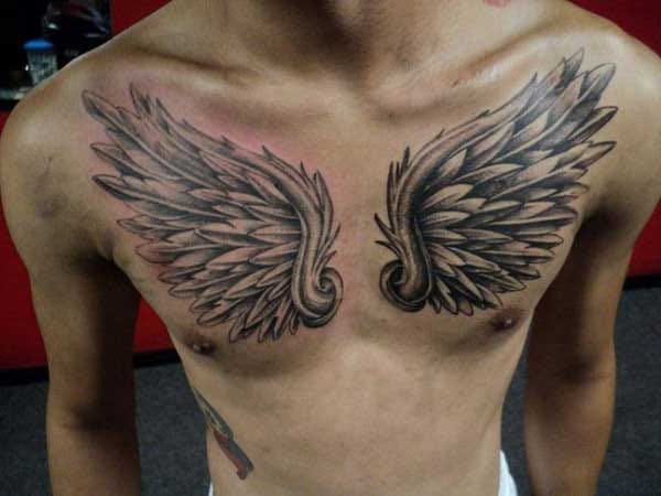 man chest wings tattoo