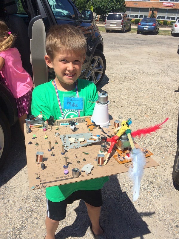 Mike McKeown with the board game he created at Camp Inventor last summer at St. Joseph's school in Hammonton.