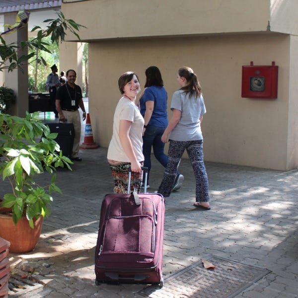 Welcome to India! Sheradia bringing a suitcase of supplies to a special-needs school in Mumbai.