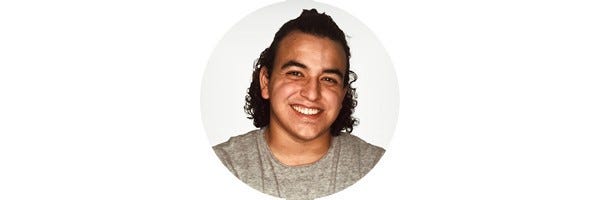 Circular profile picture of Marlon Mejia, a mixed race man with curly hair, smiling against a light gray background.