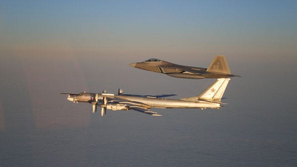 Figure 2.1: an F-22 intercepting a Tu-95. Like many air superiority aircraft, F-22 also fulfils duties as an interceptor