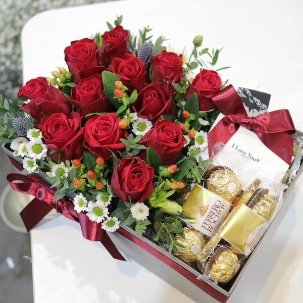 Flowers and chocolates as a new year gift on new year’s eve