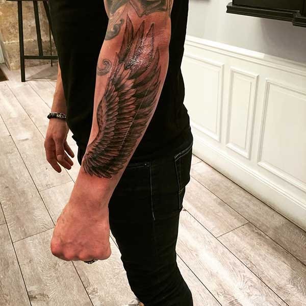 male coke wing tattoo