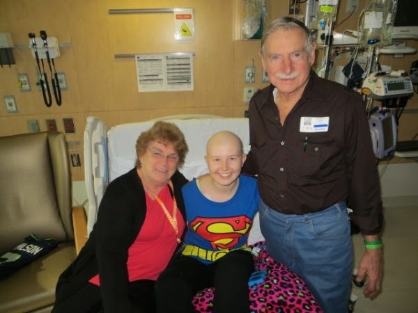 Supergirl with her super grandparents at the hospital!