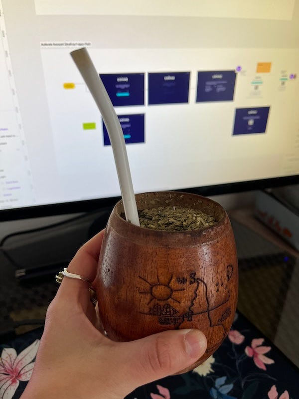 Mate recipient filled with yerbamate and hot water with a bombilla to sip