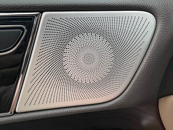 Door panel speaker grille