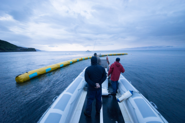 The team measuring how far deep into the ocean plastic goes. Photo Courtesy of The Ocean Cleanup