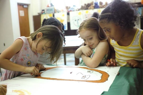 Three budding artists.