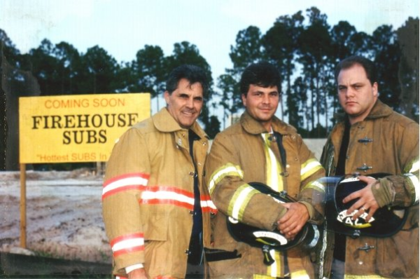 Captain Rob (left) with his sons Chris Sorensen and Robin Sorensen outside the site of the first Firehouse Subs — Jacksonville, Fl.