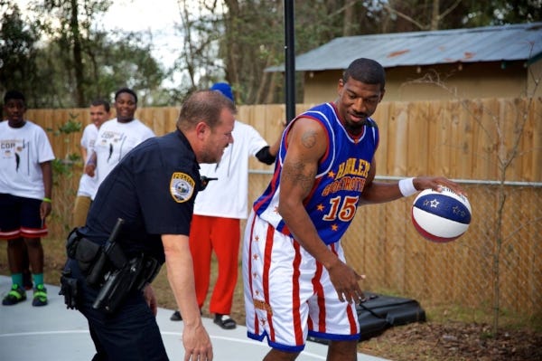 One-on-one with Harlem Globetrotter Buckets Blakes. | Source: Basketball Cop Foundation