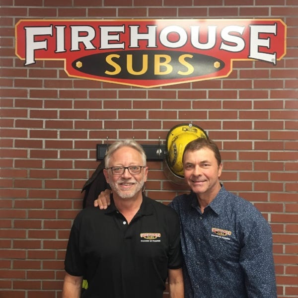 Motley with one of the Firehouse Subs Co-Founders, Chris Sorensen.