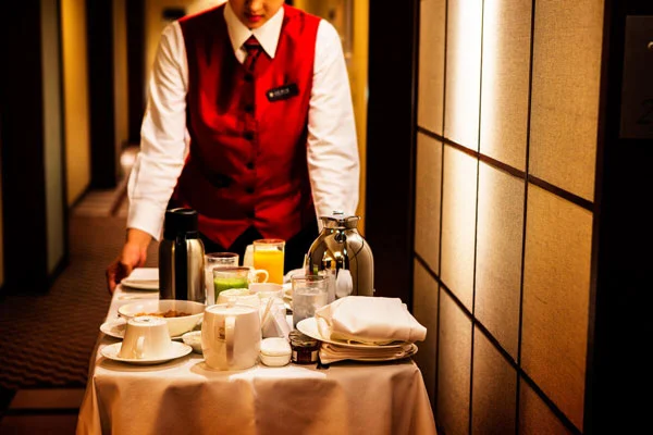 Waitress with a bussing cart