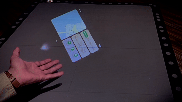 Video showing AR app for outdoor navigation. The app is following users’ hand.