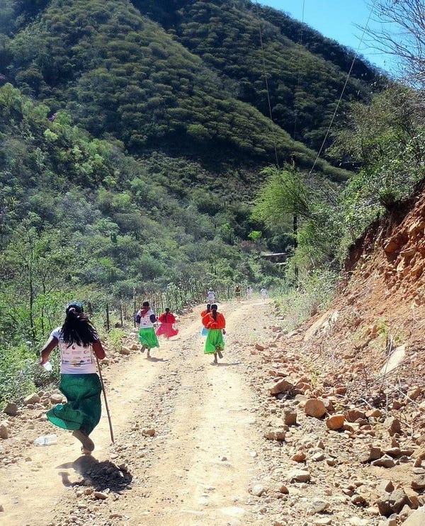 The Raramuri women running in their traditional clothes and sandals