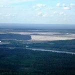 Syncrude’s Steep Bank tailings pond dike towering over Athabasca River