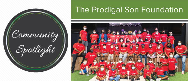 Group of youth sitting for photo with Prodigal Son Foundation staff