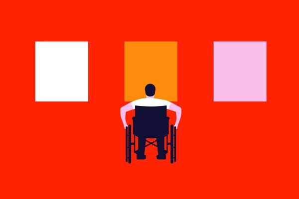 Man in wheelchair in front of red gallery wall with 3 rectangles on the far left white rectangle middle orange far right pink