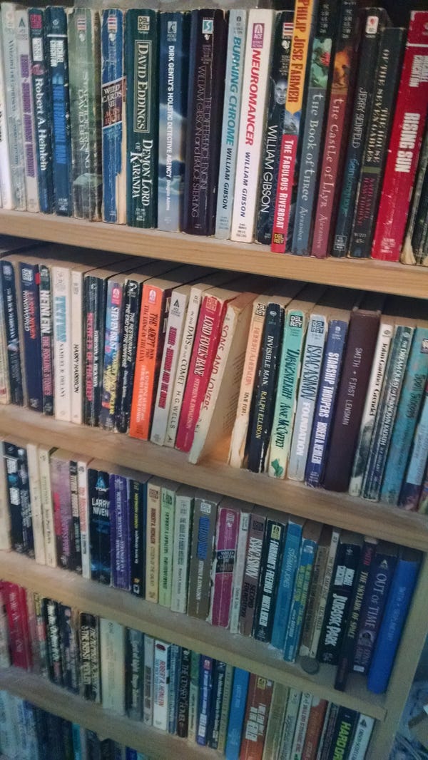 A shelf of some of my books, some of which are older than I am, and many of which were bought in the 70's. Of particular note is that classic work “half of ‘Sons and Lovers,’” by D.H. Laure.