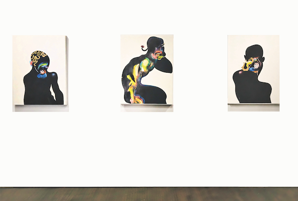 Three painting portraits by the artist Leasho Johnson hanging at FLXST Contemporary.