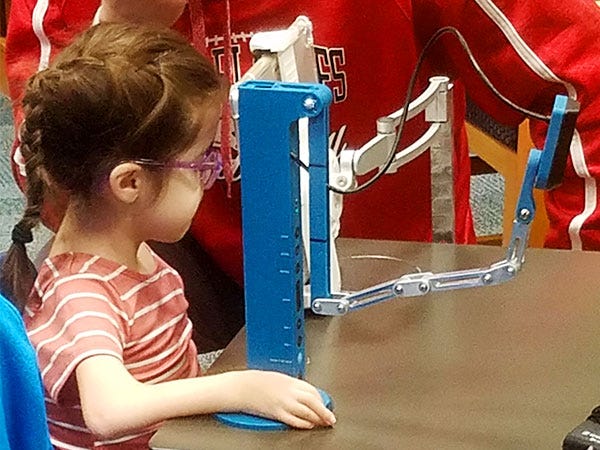 Payton trying out her newly designed document camera with her iPad. Photo courtesy of Brent Nummerdor.