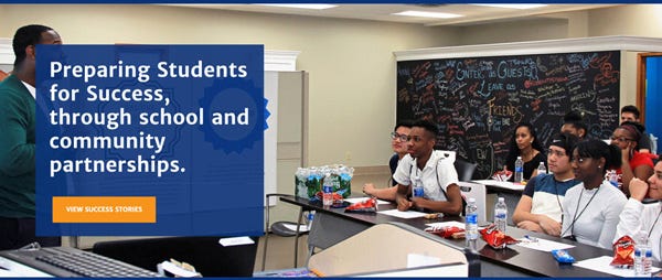 Banner image of students in classroom and large mission statement