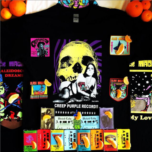 An array of products, most Black Magick SS records and merchandise, in which Nazi symbols are covered with orange slices.