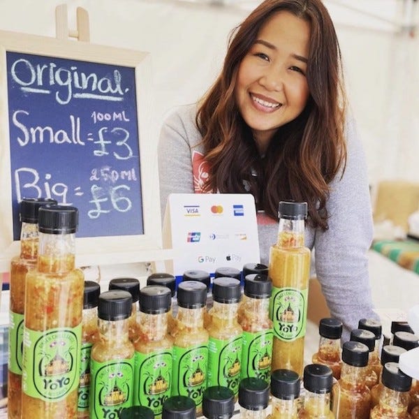 Photo of Yoyo with bottles of sauce for sale at Halifax Piece Hall Makers Market