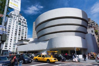 Guggenheim Museum from the outside, in the middle of the city fuss