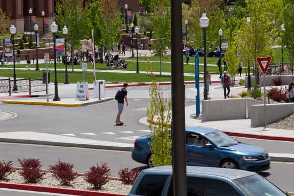 Cars and Skateboarders Share Roads In This UNR Campus Photo