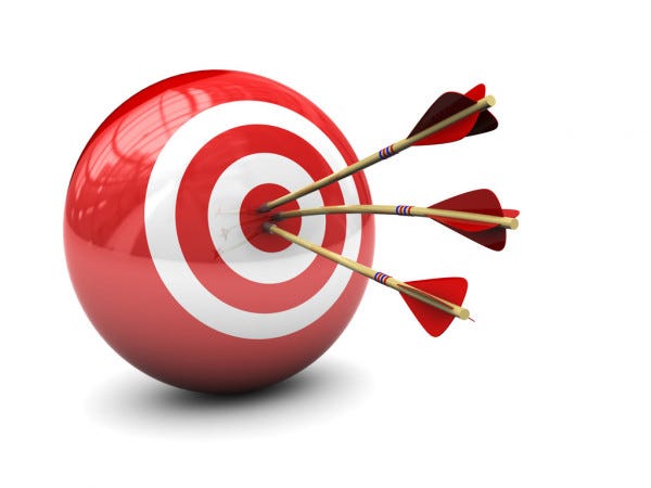 A red ball with 2 white concentric circles shows 3 arrow darts hitting the bullseye.