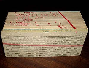 Image of a stack of punch cards comprising a computer program