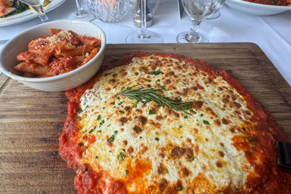 Chicken parmigiana with a side of pasta from a Northern New Jersey Italian restaurant.