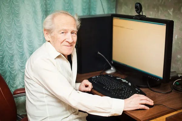 Old man with computer.