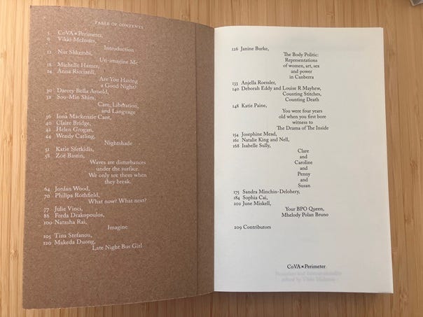 Open book with cardboard cover, showing chapter list laid out in a poetic form