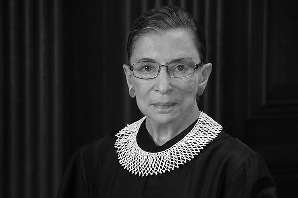 Associate Justice Ruth Bader Ginsburg sits in a crocheted collar a steely resolve.