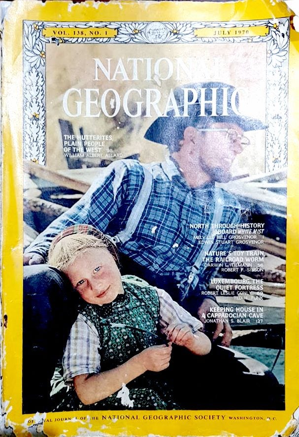 The cover page of the Magazine. Featured is a Hutterite Father and his child.