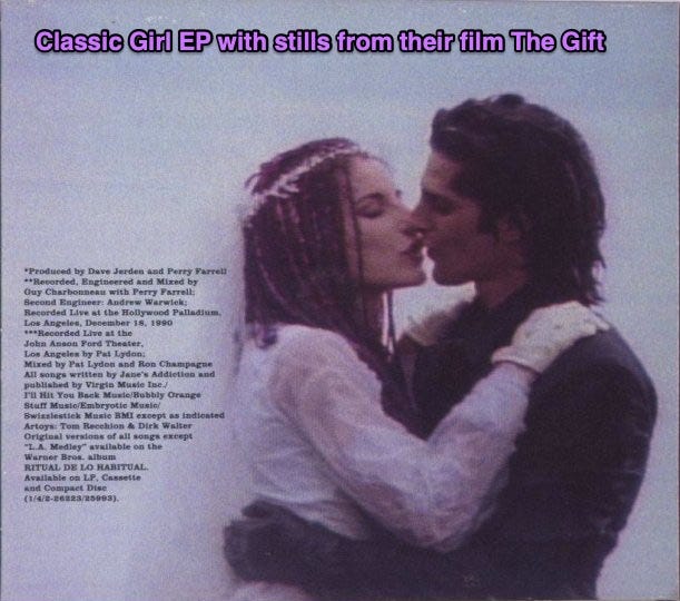 The back cover of The Gift EP. Perry is kissing artist and frequent collaborator Casey Nicolli at their wedding.