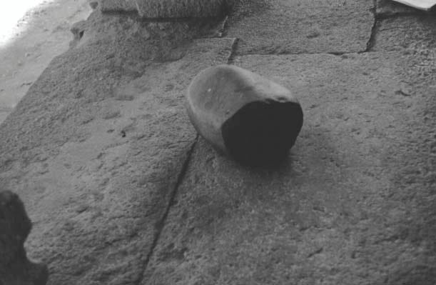Black and white picture of a large grinding stone