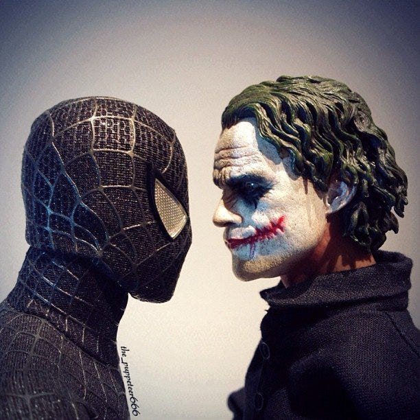 Spiderman locks eyes with The Joker.