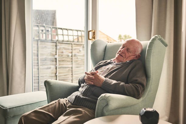 A stock image of an elderly man in a comfortable grey cardigan and brown pants, asleep in front of a window in what could be his lounge room, seated in a slightly reclined upholstered light green chair. He is asleep because all this talk of money and contracts has been so incredibly boring. He may actually be dead, I couldn’t say.