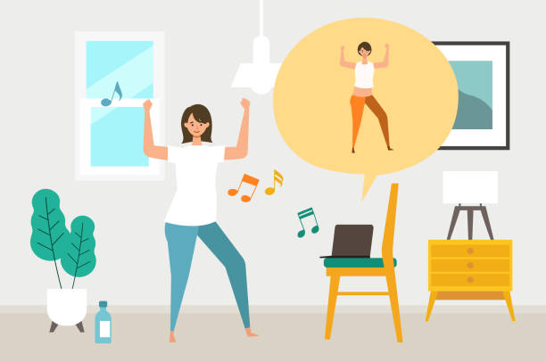 A woman dancing in her living room with her laptop displaying a teacher doing the same dance move.