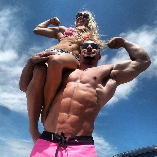 An image of a ridiculously athletic man and woman, possessing abdominal muscles that are so defined you could grate cheese on them.