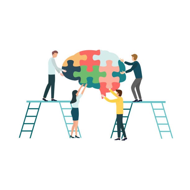 An illustration of four people on ladders trying to put together puzzle pieces to make a brain.