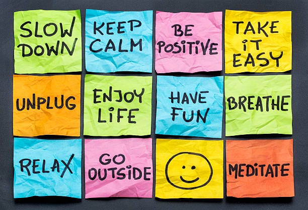 Motivational quotes and a smiley on sticky notes in different colors from pixabay.com