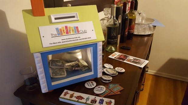 You too can make a donation to The Literacy Club. On the table: bookmarks, pins, and magnets supporting the Little Free Library movement.