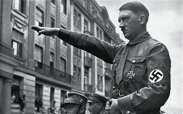 Adolf Hitler using the downward-facing palm gesture