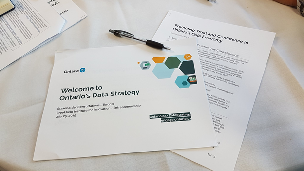 Two discussion papers on a table which read Welcome to Ontario’s Data Strategy.