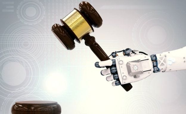 Image of a robot hand holding a gavel
