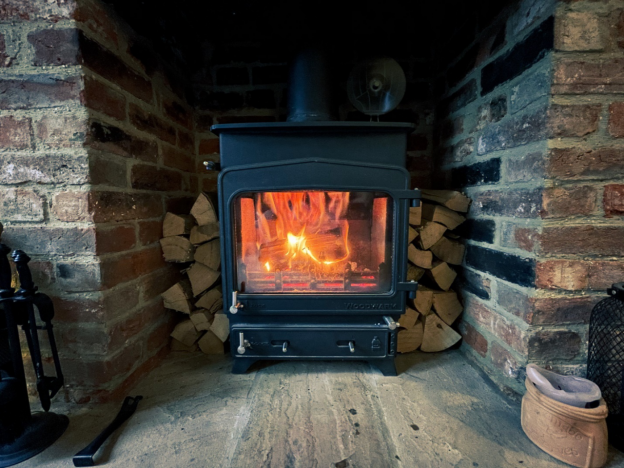 A wood furnace in a room