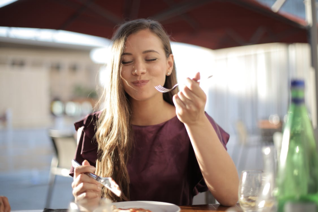 A young woman enjoying her food